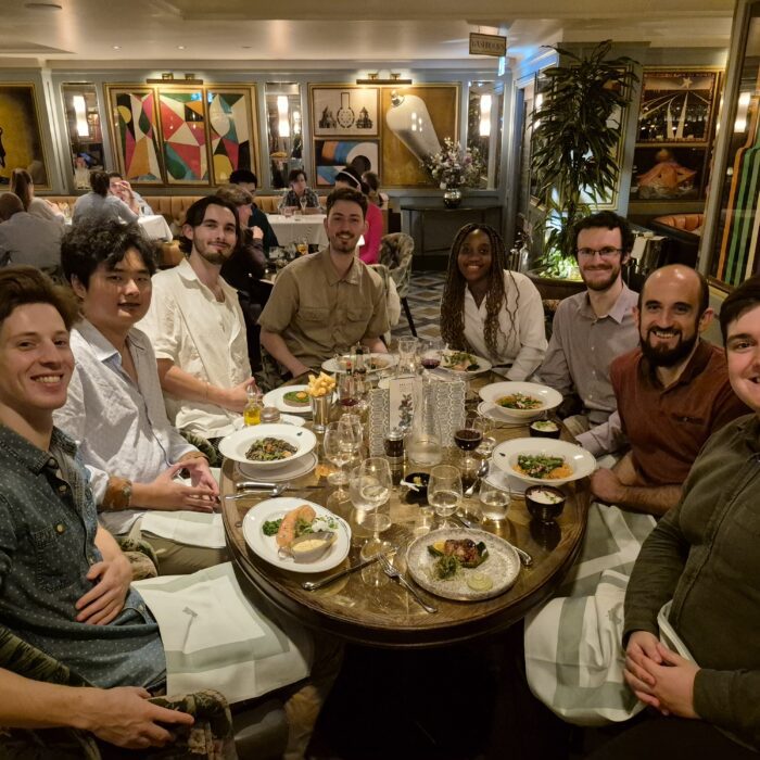 Group of friends enjoying a meal at a restaurant.