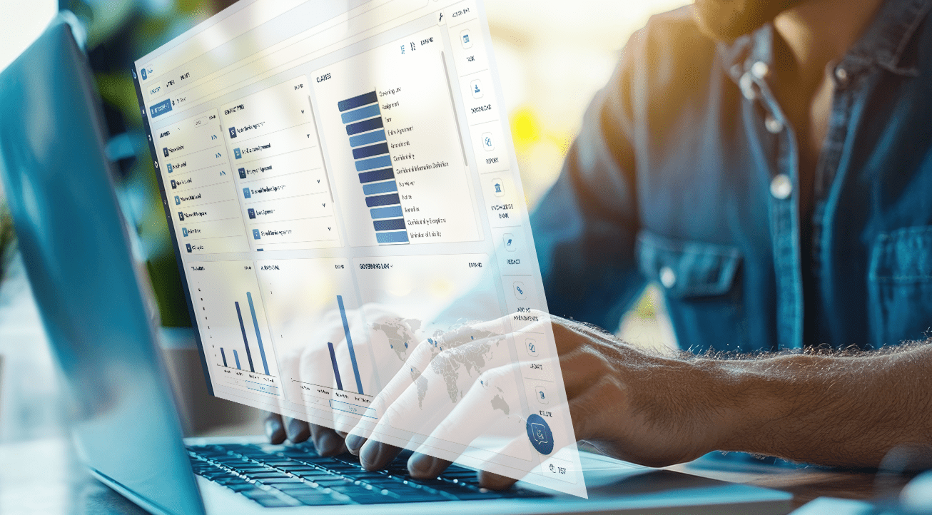 Hands typing on a laptop displaying data analytics.
