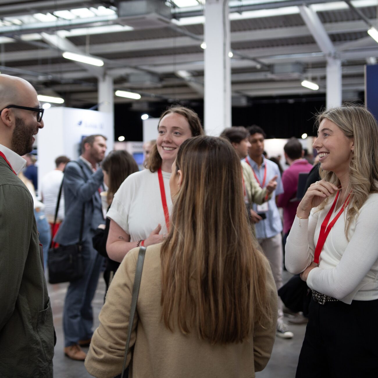 Group of people networking at a professional event.