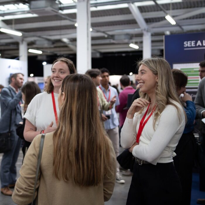 Group of people networking at a professional event.